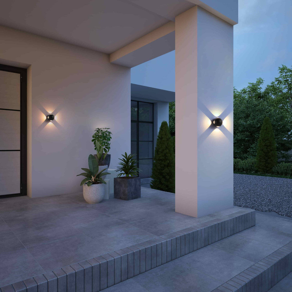 black outside wall light fixture fitted on a white wall outside a modern home covered porch area