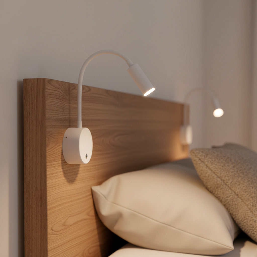 white dimmable bedroom reading light installed over a bed on a wooden headboard