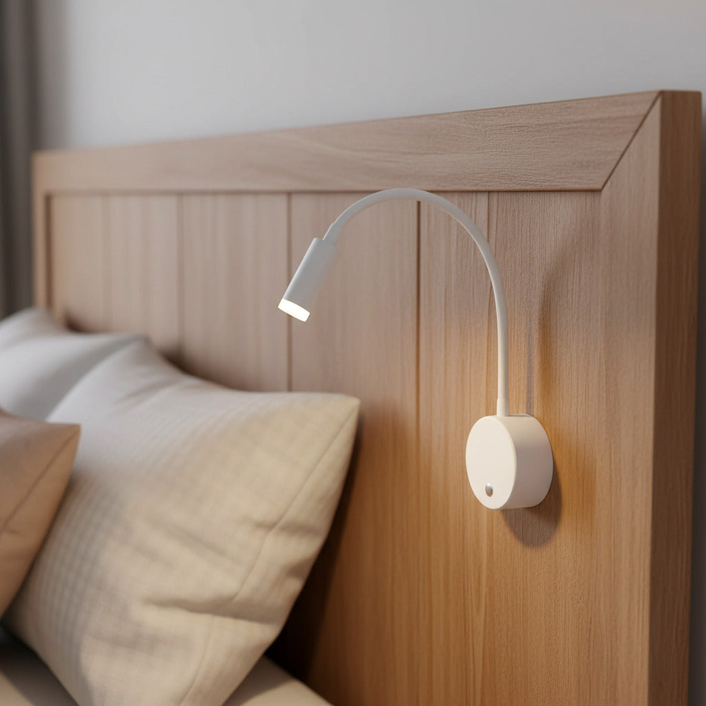 white dimmable bedroom reading light mounted on a wooden headboard