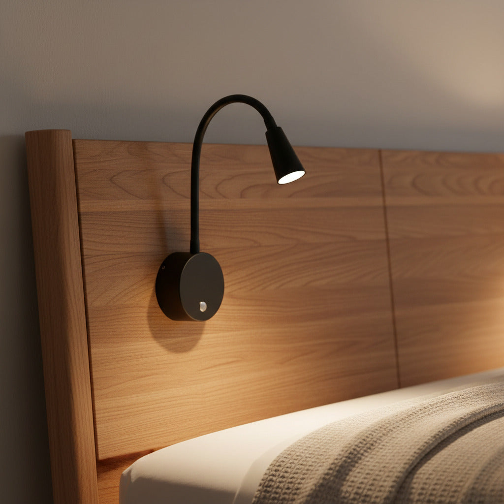 black dimmable bedside reading light installed on a modern bed headboard