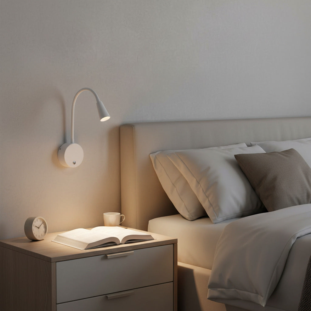 white dimmable bedroom reading lamp mounted on the wall next to a bed 