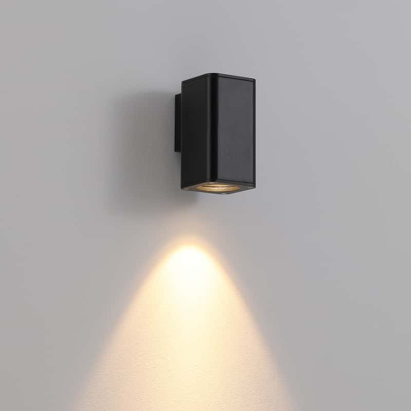 black out door wall downlight mounted on a white wall 