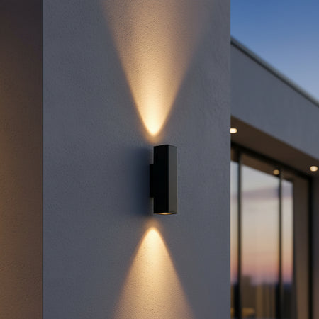 12 watt black up and down exterior light mounted on the outside of a house