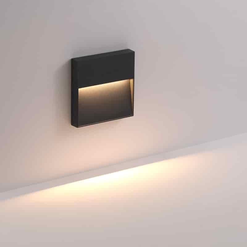 black LED stair light outdoor installed on a white wall 