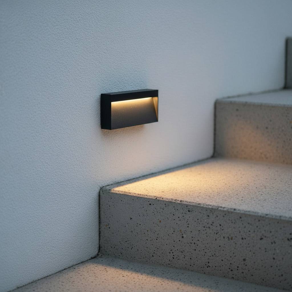 black light for garden steps mounted on a wal next to concrete steps outside