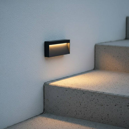 black light for garden steps mounted on a wal next to concrete steps outside