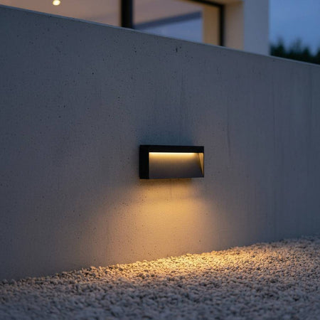 black light for garden steps mounted at low level of a garden wall shining onto stones below
