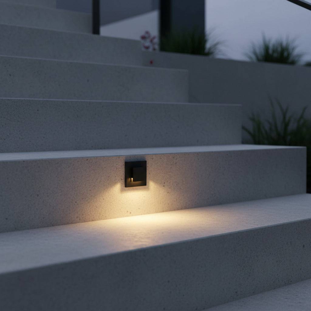 black exterior stair lighting mounted in the concrete step of a modern home outdoor stairway