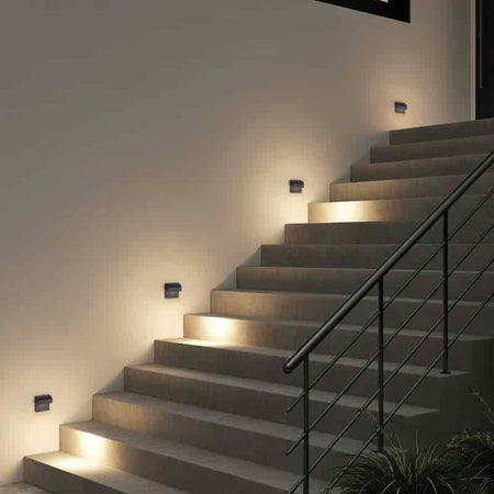 black light for outdoor stairs fitted on the wall alongside an outside stairway