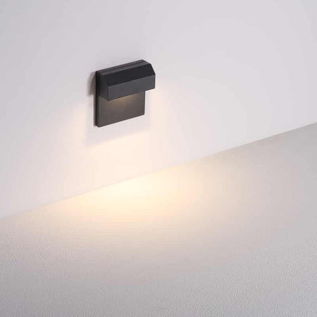black light for outdoor stairs mounted on a white wall 