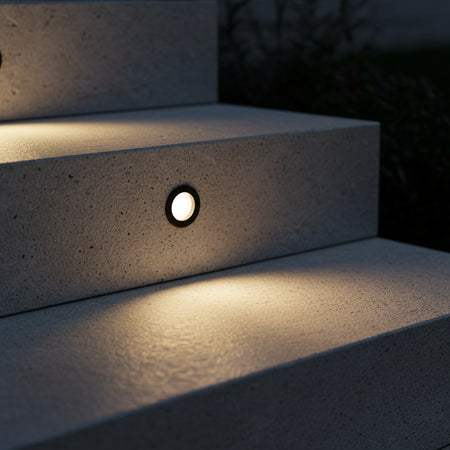 3 watt black inset garden wall light installed in an outside step riser