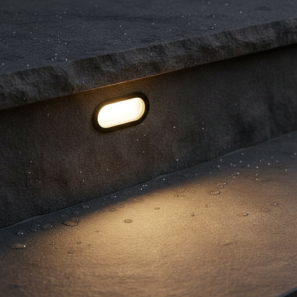 6 watt black oval recessed exterior wall light installed on an exterior step 