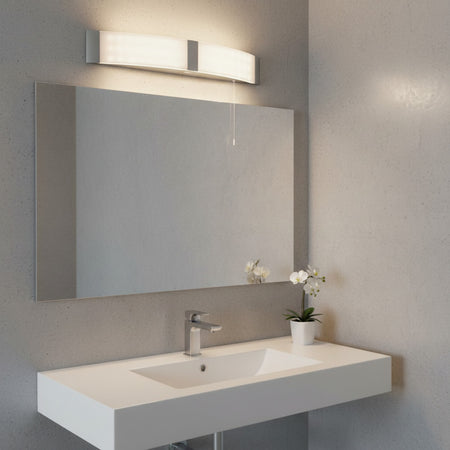 bathroom shaver light mounted above a mirror in a modern bathroom