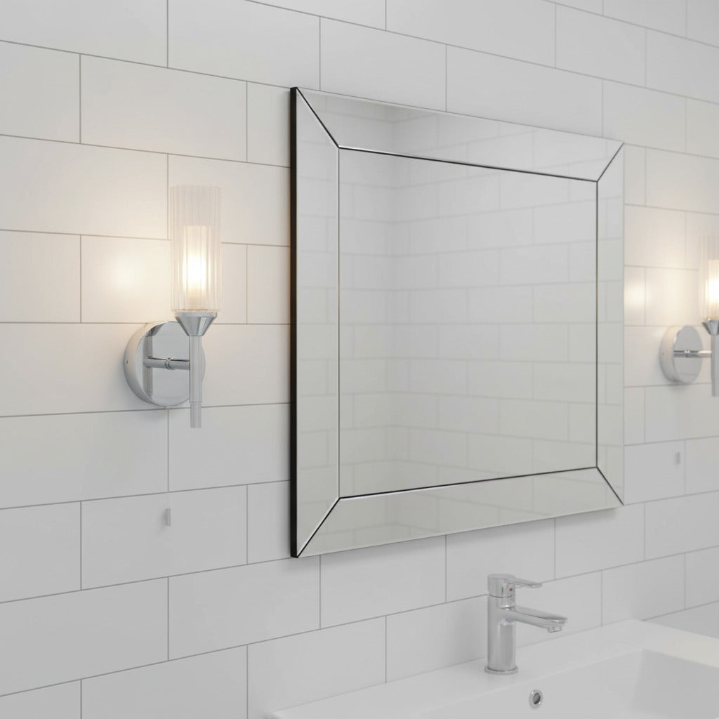 chrome bathroom wall light with pull cord mounted either side of a bathroom mirror 