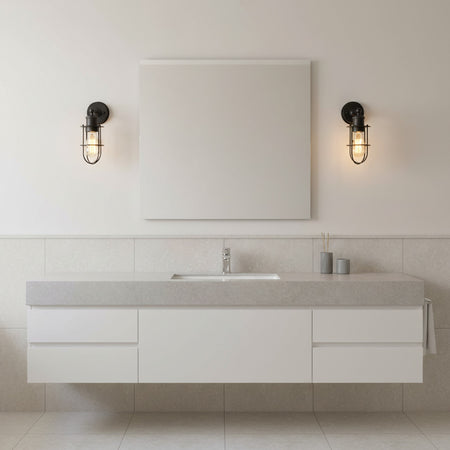 matt black bathroom wall light mounted either side of a bathroom mirror 