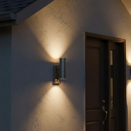 stainless steel PIR outdoor wall light mounted on the wall next to a house front door 