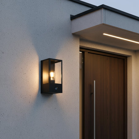 black outside sensor wall light installed next to the enntrance door of a modern house