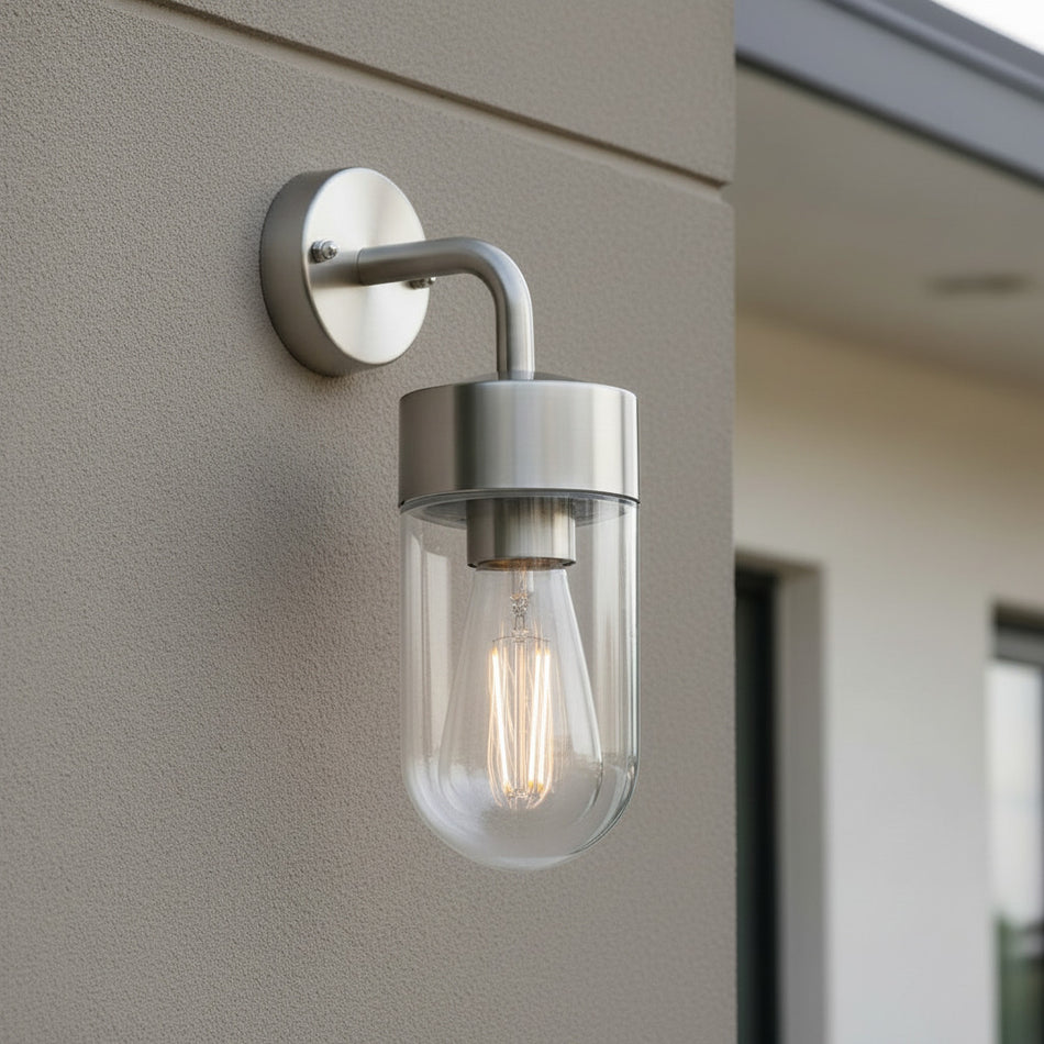 stainless steel exterior lantern wall light mounted on the exterior wall of a house
