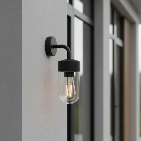 black lantern outside light installed on a grey exterior wall 
