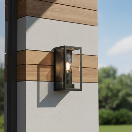 black outdoor wall sconce mounted on a modern home exterior wall 