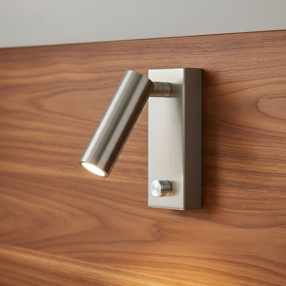 brushed nickel dimmable wall mounted reading light mounted on a wooden headboard