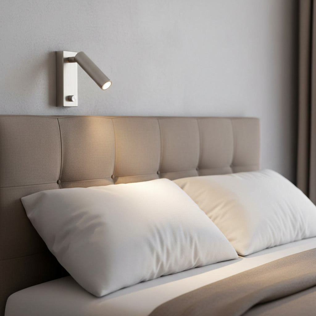 brushed nickel dimmable wall mounted reading light mounted over a bed. 