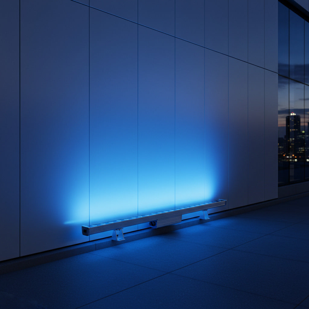 blue LED linear wall grazer lighting up the exterior of a commercial building