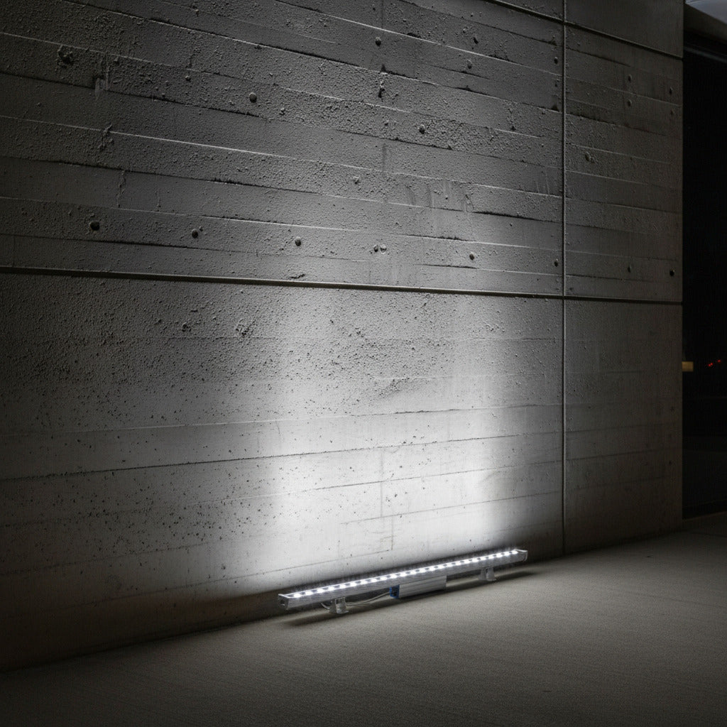 cool white linear wall washer shining up a concrete wall 