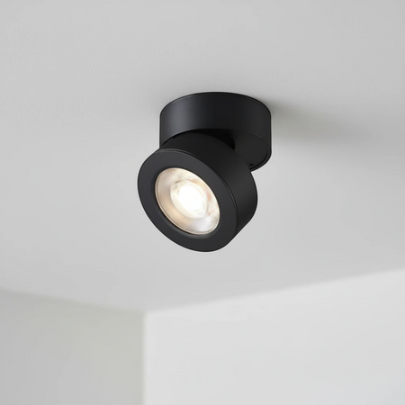 Ultra Beam Lighting Ltd 12 watt black adjustable LED ceiling spotlight with a rotating head for directional lighting.