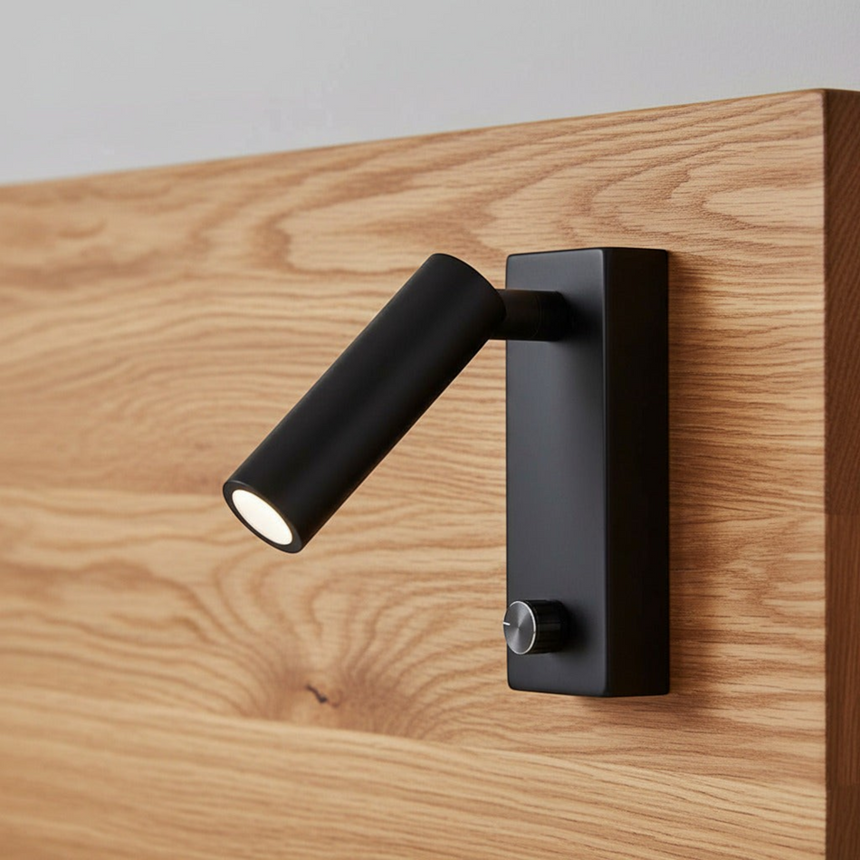 black dimmable bedside reading lamp mounted on a wooden headboard