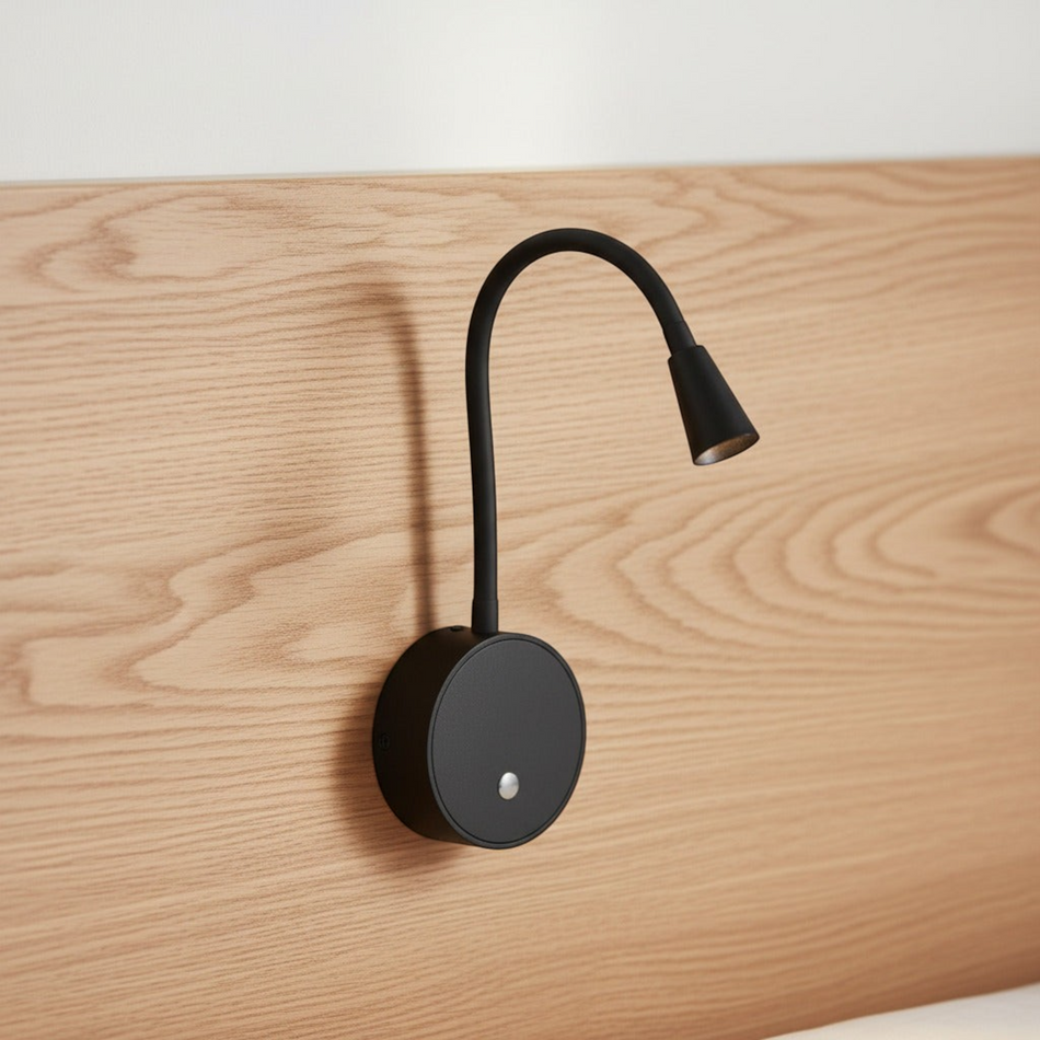 Ultra Beam Lighting Ltd black flexible LED reading light with touch switch mounted on a wooden headboard