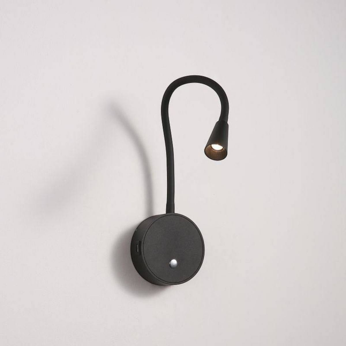 Ultra Beam Lighting Ltd black flexible LED reading light with a touch switch and integrated USB charging ports.
