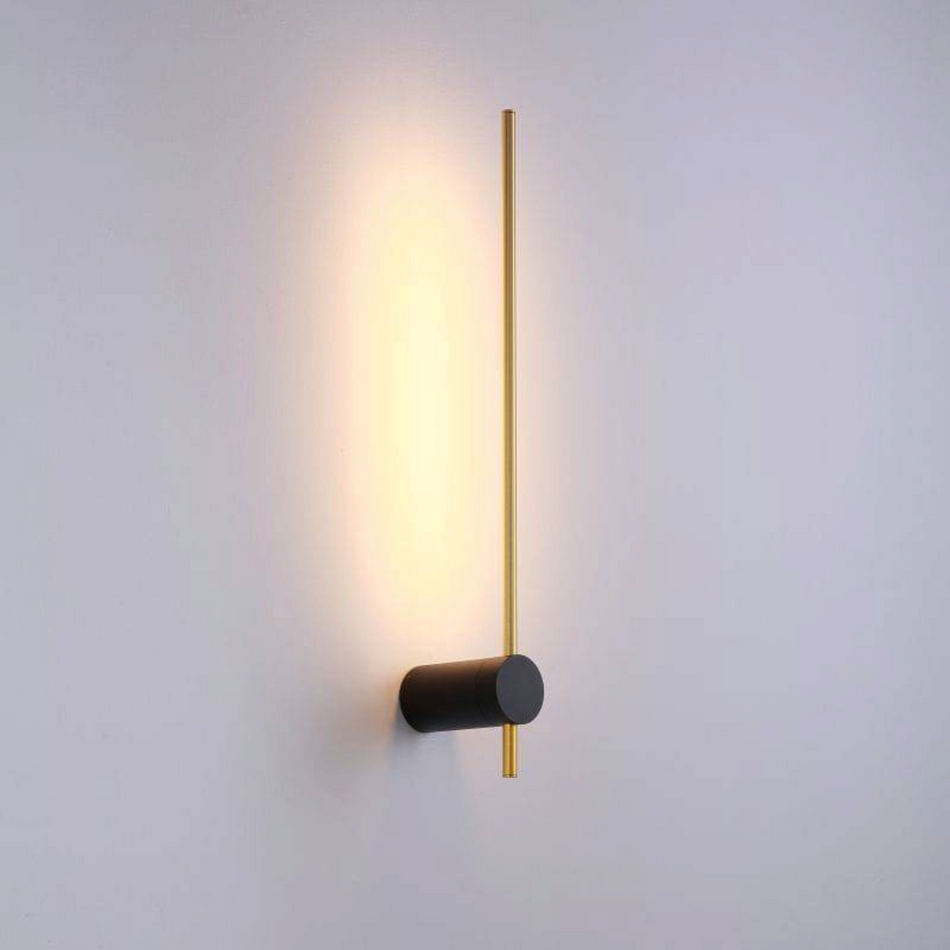 Ultra Beam Lighting Ltd 6W LED wall sconce in black and gold with a cylindrical base and warm backlit illumination.