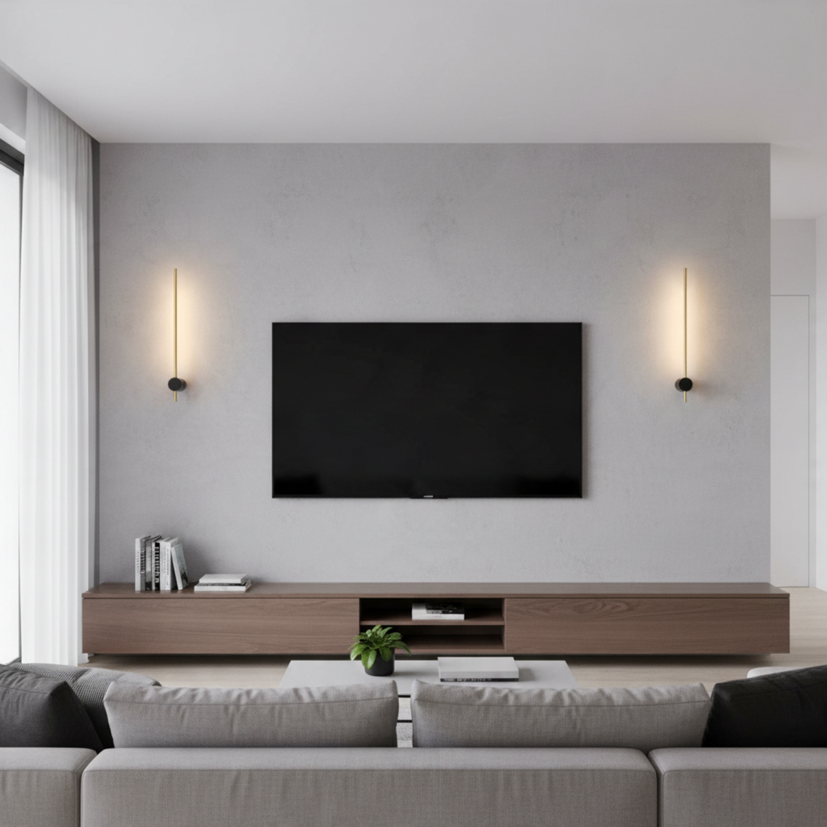 Ultra Beam Lighting Ltd black and gold LED wall sconces providing warm ambient light in a modern living room
