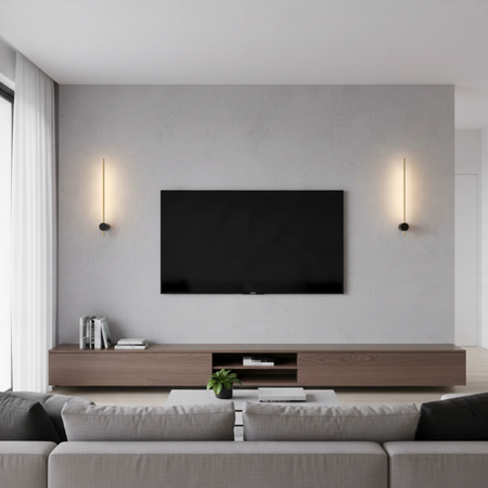 Ultra Beam Lighting Ltd black and gold LED wall sconces providing warm ambient light in a modern living room