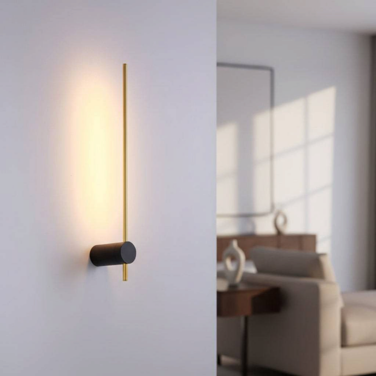 Ultra Beam Lighting Ltd 6W LED wall sconce in black and gold with a cylindrical base and slender backlit metal post.