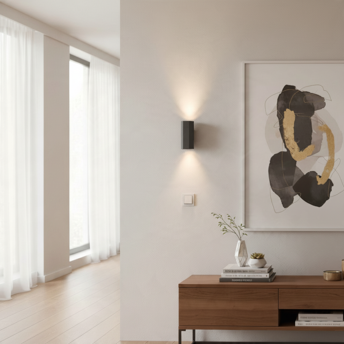 Ultra Beam Lighting Ltd hexagonal black wall light casting warm up and down beams on a modern living room wall