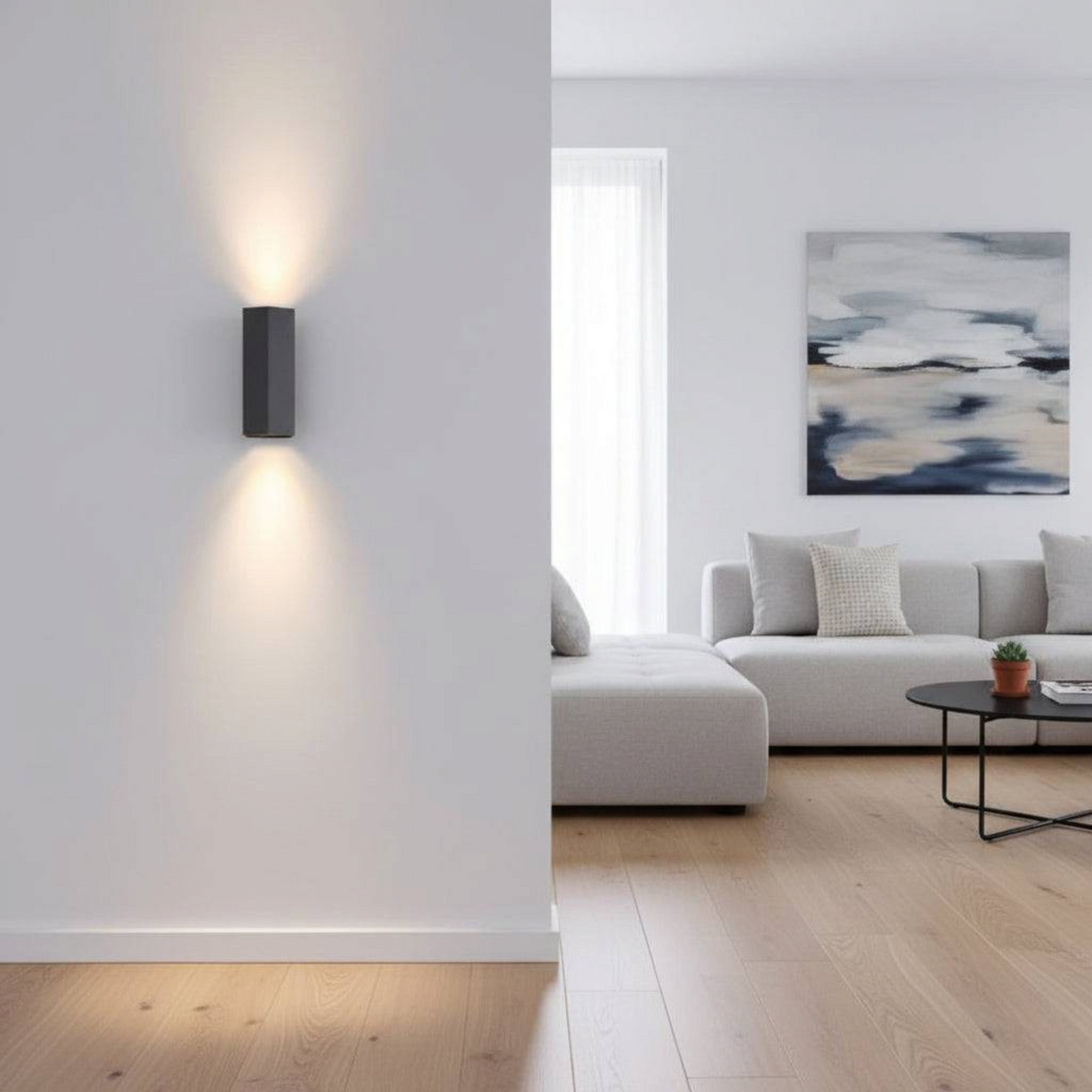 Ultra Beam Lighting Ltd black hexagonal up and down wall light casting warm light on a modern living room wall