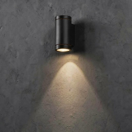Ultra Beam Lighting Ltd 6 watt black aluminium LED outdoor wall downlight casting a warm light on a textured wall