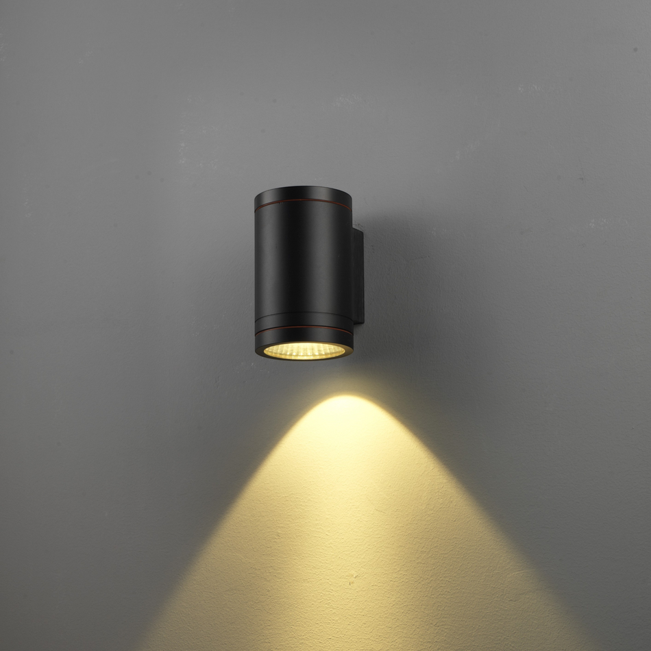 Ultra Beam Lighting Ltd 12W LED black outdoor wall downlight casting a warm downward beam on a grey wall