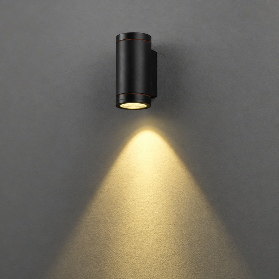 Ultra Beam Lighting Ltd 6W black aluminium LED outdoor wall downlight casting a warm light beam on a grey wall