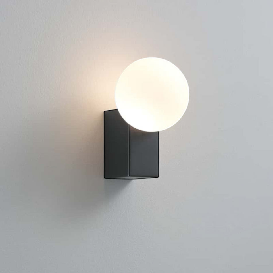 Ultra Beam Lighting Ltd 6W LED outdoor wall globe light with a modern black finish and glowing spherical glass shade.