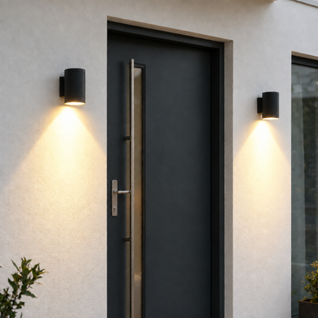 Ultra Beam Lighting Ltd black LED outdoor wall downlights illuminating a modern front door entrance.