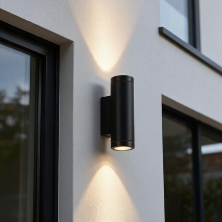 Ultra Beam Lighting Ltd 12W LED black outdoor up and down wall light mounted on a white exterior wall