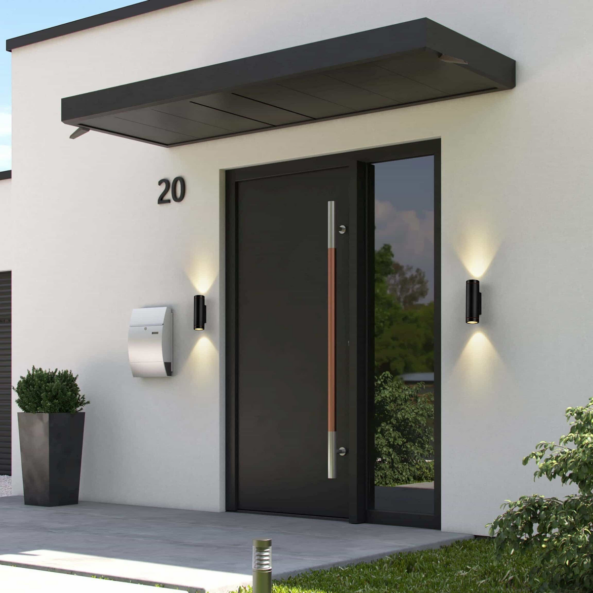 Ultra Beam Lighting Ltd black LED up and down outdoor wall lights mounted on a modern white house entrance.