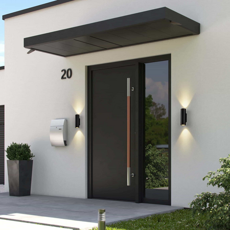 Ultra Beam Lighting Ltd black LED up and down outdoor wall lights mounted on a modern white house entrance.