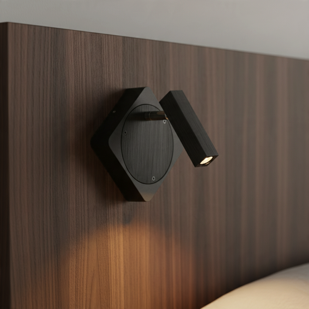 Ultra Beam Lighting Ltd Seville black LED wall reading light with adjustable head mounted on a wooden headboard