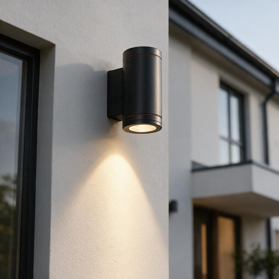 Ultra Beam Lighting Ltd 6W black aluminium LED outdoor wall downlight mounted on a modern white exterior wall