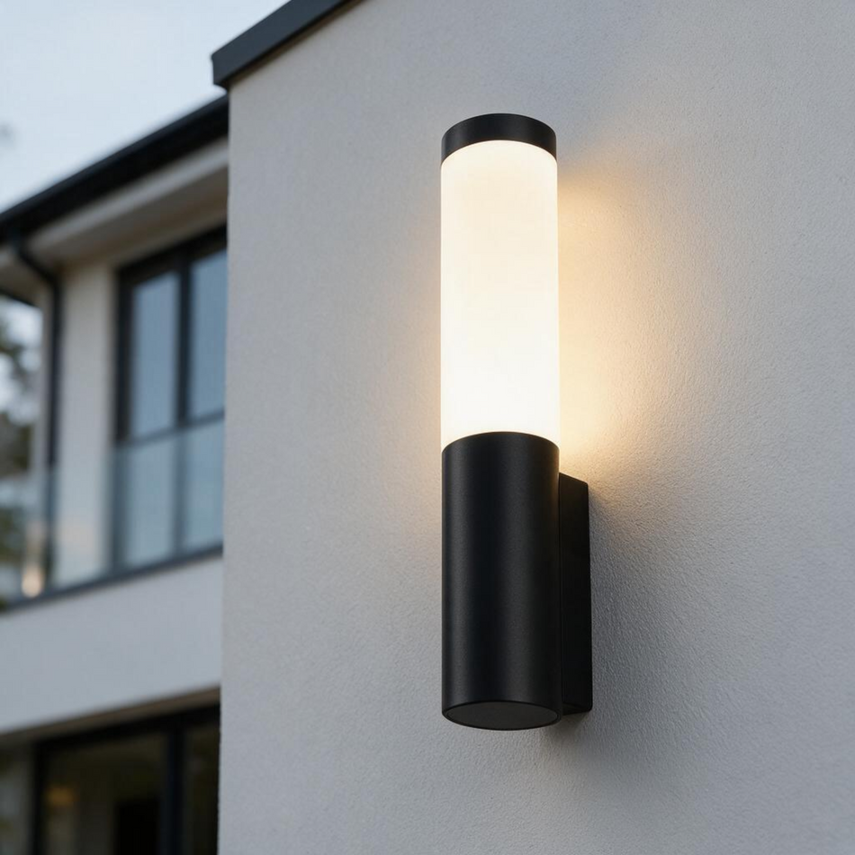 Ultra Beam Lighting Ltd modern black cylindrical LED outdoor wall lantern with opal acrylic diffuser on white wall