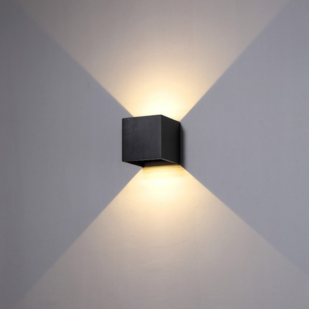 Ultra Beam Lighting Ltd 6 watt square black LED outdoor wall light with up and down beam effect on a grey wall
